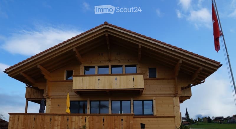 wooden house, 2 stories, balcony, windows, red roof