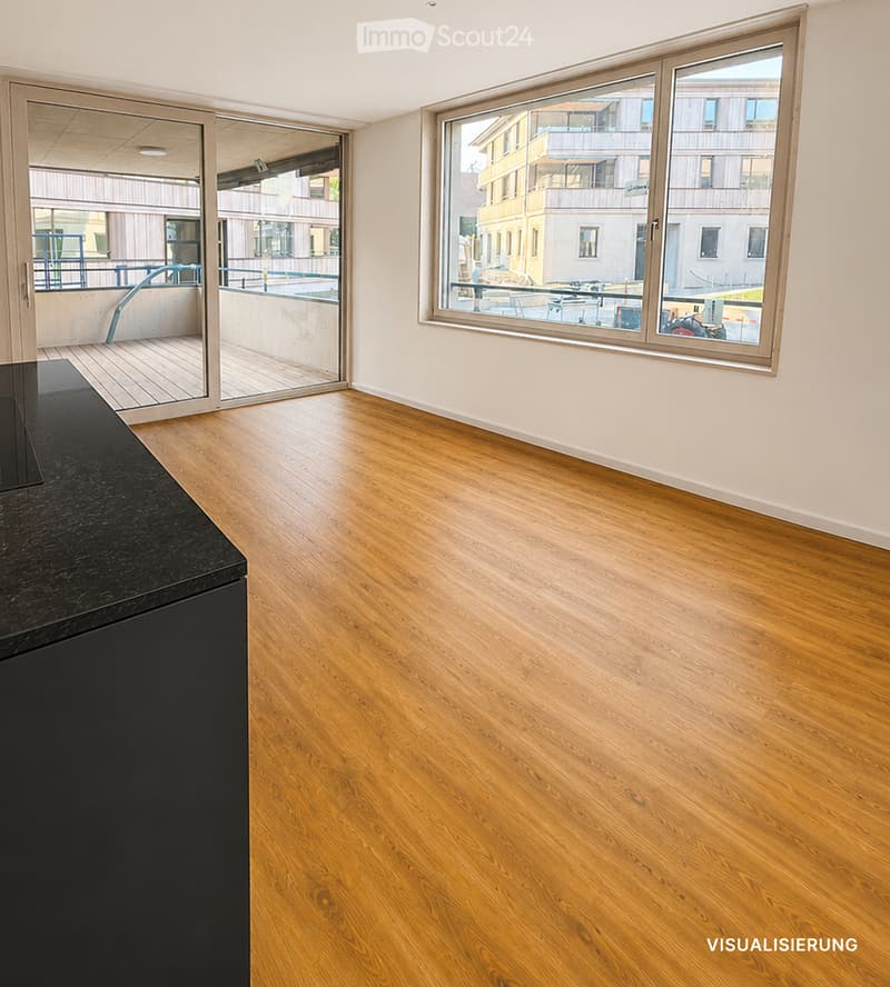 Empty room with wooden flooring, large windows, and a sliding glass door leading to a balcony.