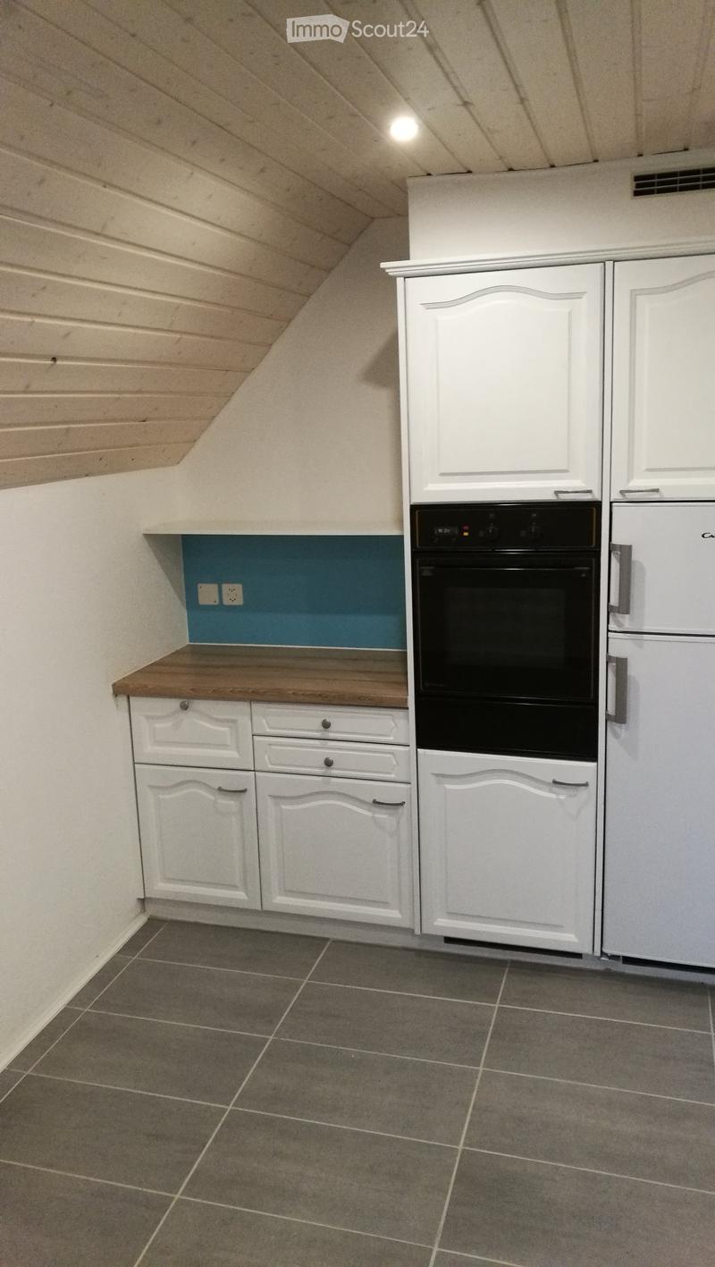 kitchenette with built-in oven, refrigerator, countertop, white cabinets, tiled flooring