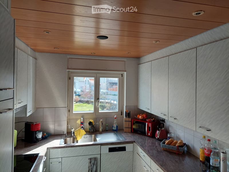 {"type": "Kitchen", "objects": ["sink", "faucet", "coffee maker", "microwave", "kettle", "cupboard", "bottle", "fridge", "oven", "dish rack", "faucet", "cup", "bottle", "oven", "cupboard", "bottle", "oven", "cupboard", "bottle", "oven", "cupboard", "bottl