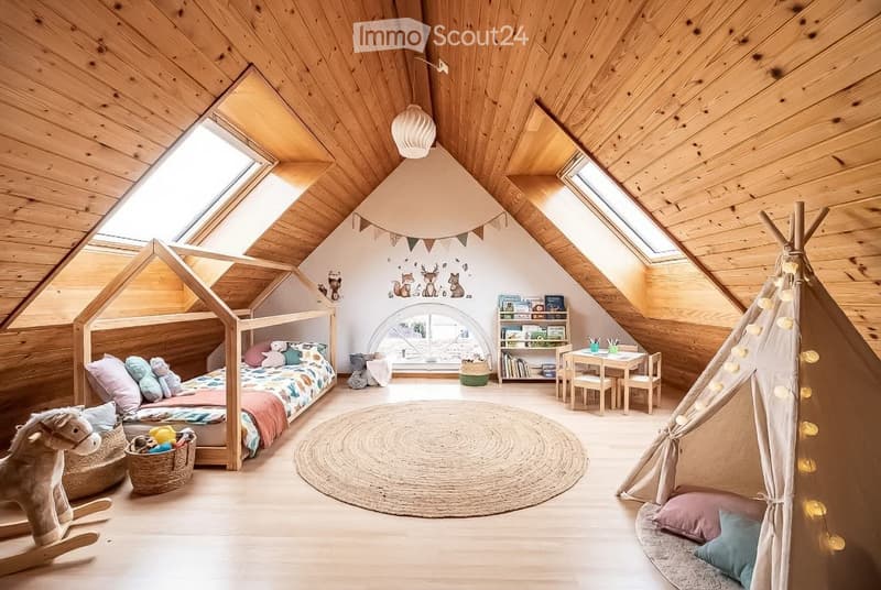 Cozy attic bedroom with wooden beams, skylights, a lofted bed, a rocking horse, a small table and chairs, a bookshelf, and a teepee tent.