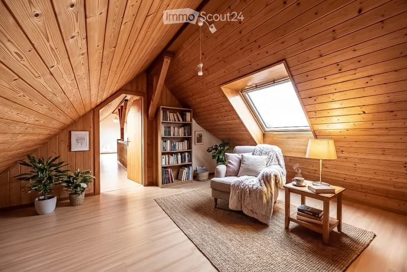 Cozy attic living room with wooden walls and ceiling, skylight window, sofa, coffee table, bookshelf, and plants.