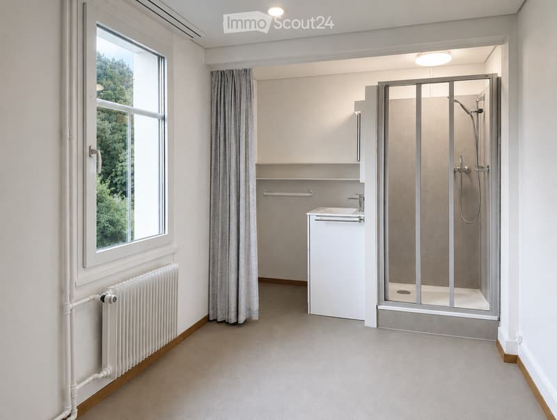 Modern bathroom with a large window, white sink, glass-enclosed shower, and grey curtain.