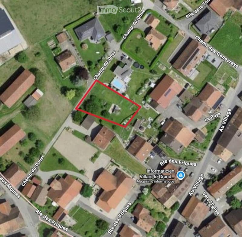 Aerial view of a residential area with houses, streets, and a highlighted plot of land featuring a swimming pool.