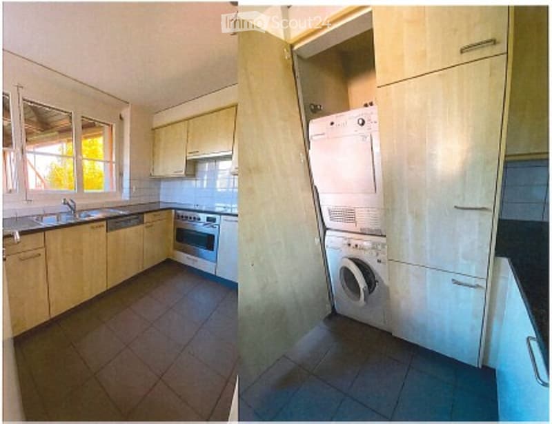 Modern kitchen with light wooden cabinets, stainless steel appliances including a sink, dishwasher, and oven. Adjacent laundry area with a washing machine.
