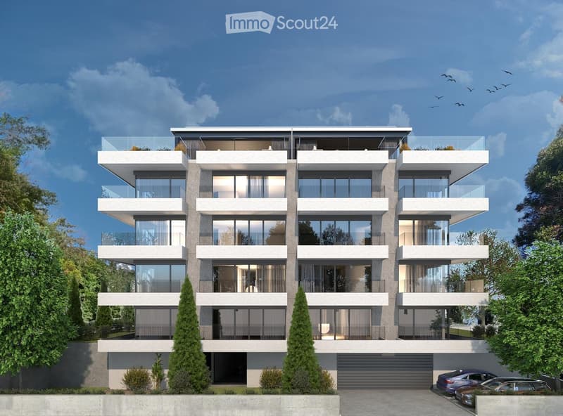 Modern multi-story residential building with large glass windows, balconies, and a garage. Surrounded by trees and parked cars.