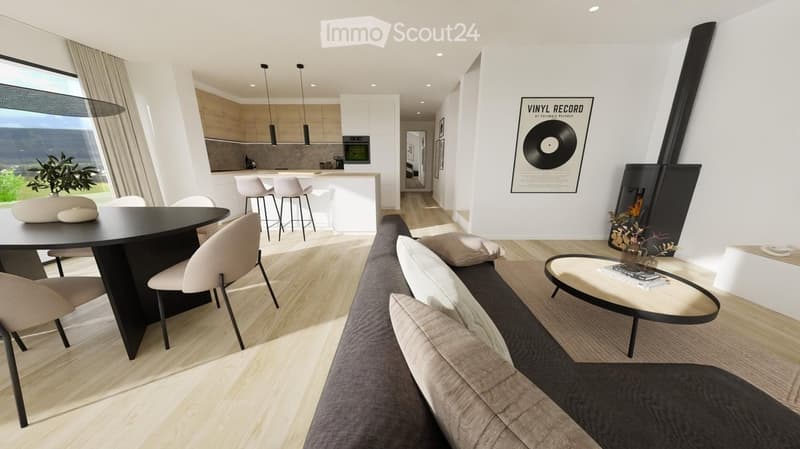 Modern open-plan living and dining area with a view, featuring a grey sofa, coffee table, dining table with chairs, kitchen island with stools, and a fireplace.
