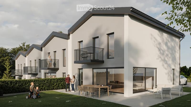 Modern two-story house with white exterior, large windows, balconies, and a spacious outdoor patio area with a dining table and seating.