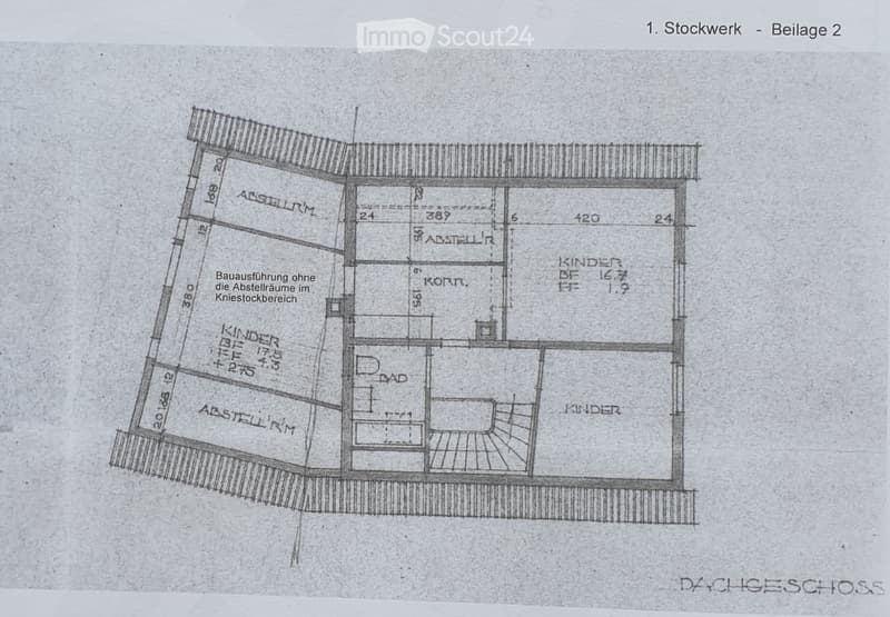 Floor plan of a residential building showing multiple rooms including a kitchen, living room, and bedrooms, with labeled dimensions and room names.