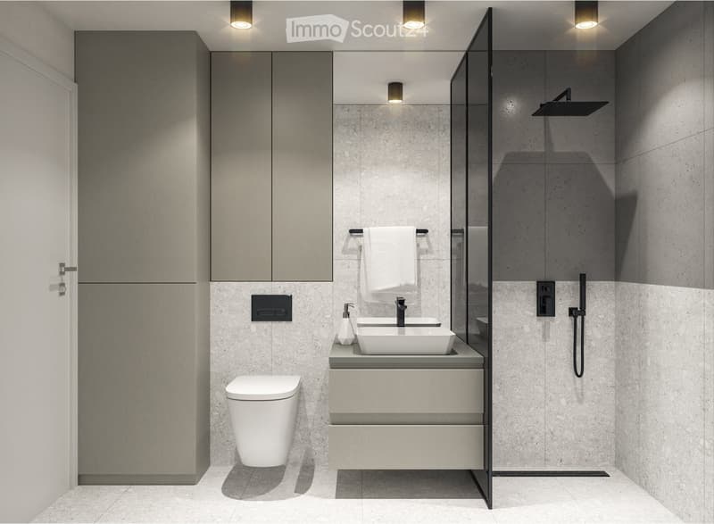 Modern bathroom with a sleek, minimalist design. Features include a white toilet, double sink vanity with a modern faucet, a large mirror, a towel rack, and a contemporary showerhead.
