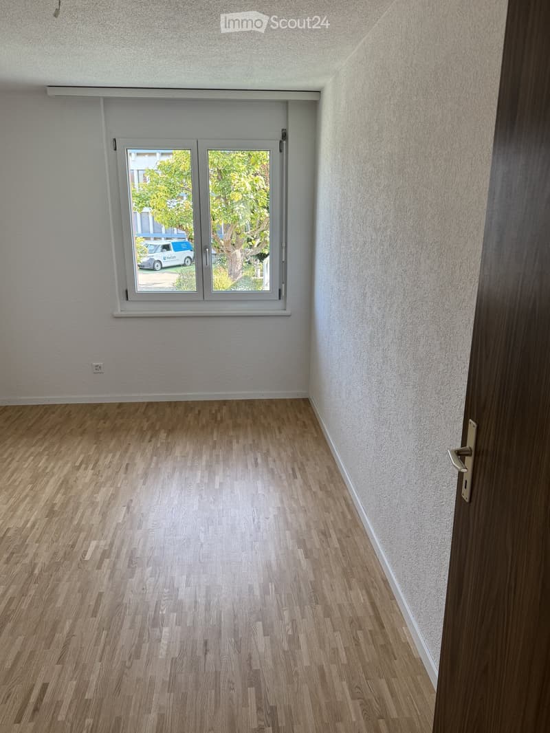 empty room, white walls, wooden floor, large window