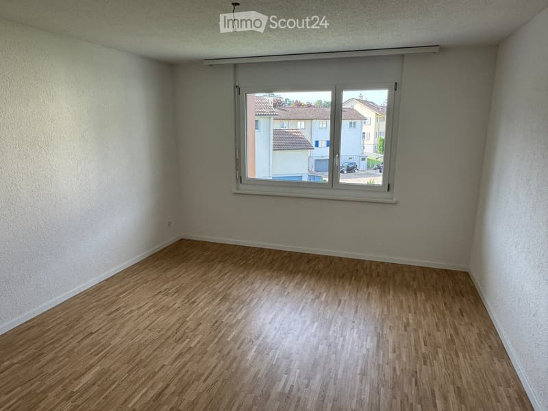 empty room, white walls, wooden floor, window, view of outside