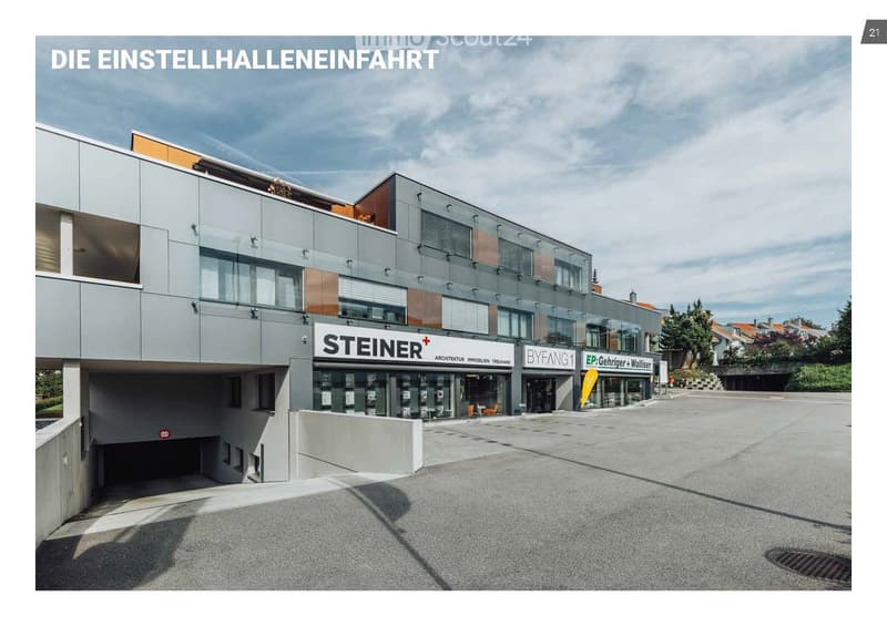 Modern multi-story building with glass and metal facade, signage for 'STEINER' and 'BYFANG1', and a spacious paved entrance area.