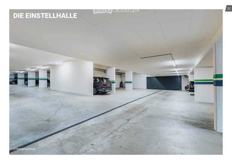 Underground parking area with concrete floors, white pillars, and several parked cars.
