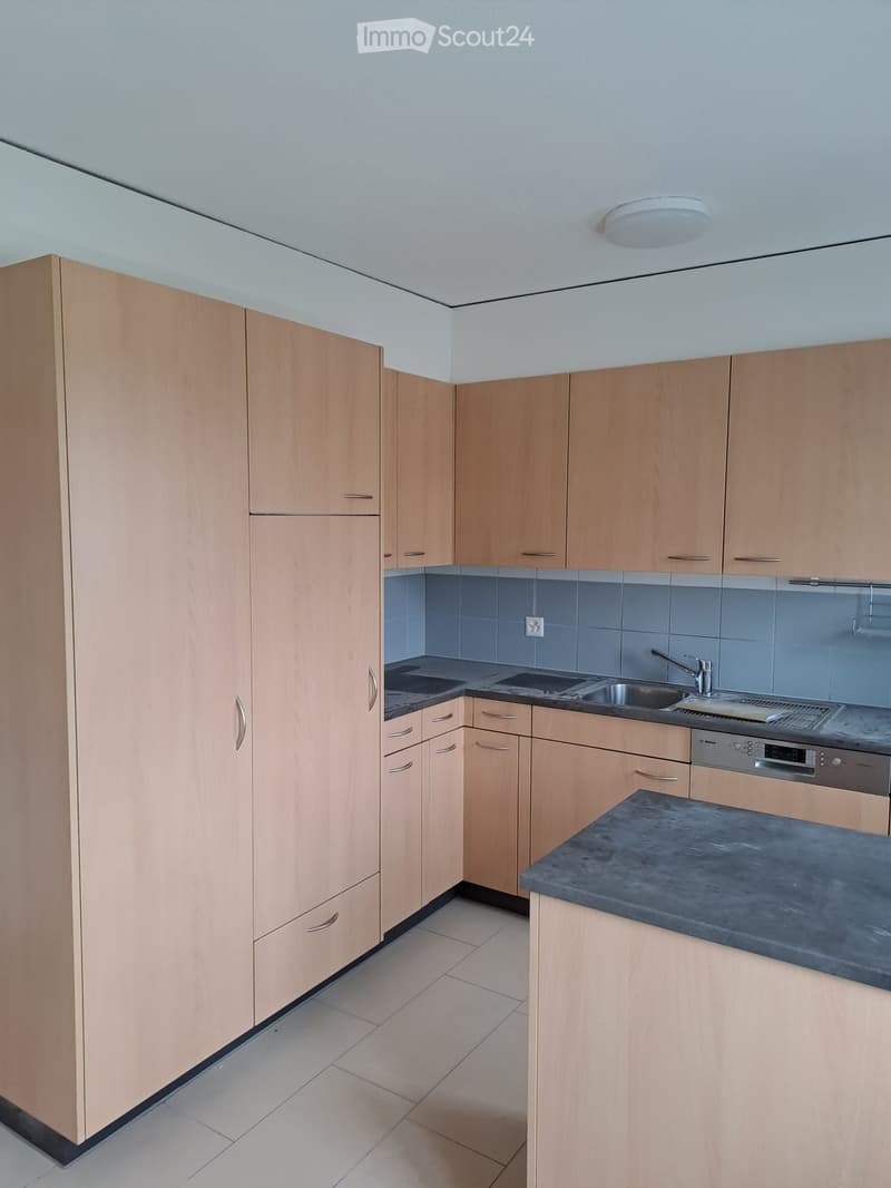 modern design, wooden cabinets, white tiled floor, granite countertops, stainless steel appliances, recessed lighting
