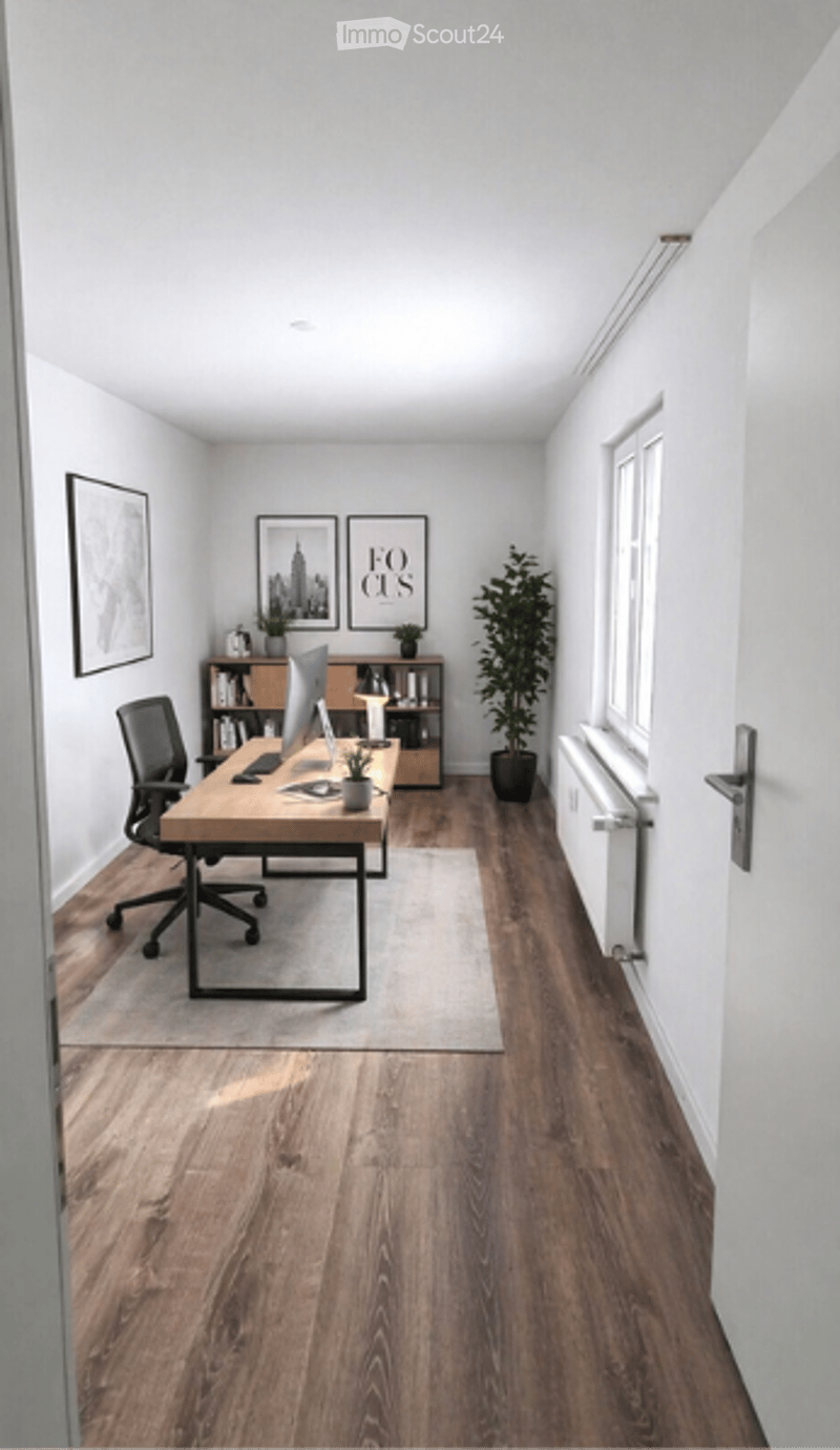 Modern office space with wooden flooring, white walls, a desk with a laptop, a chair, a bookshelf, and a potted plant.