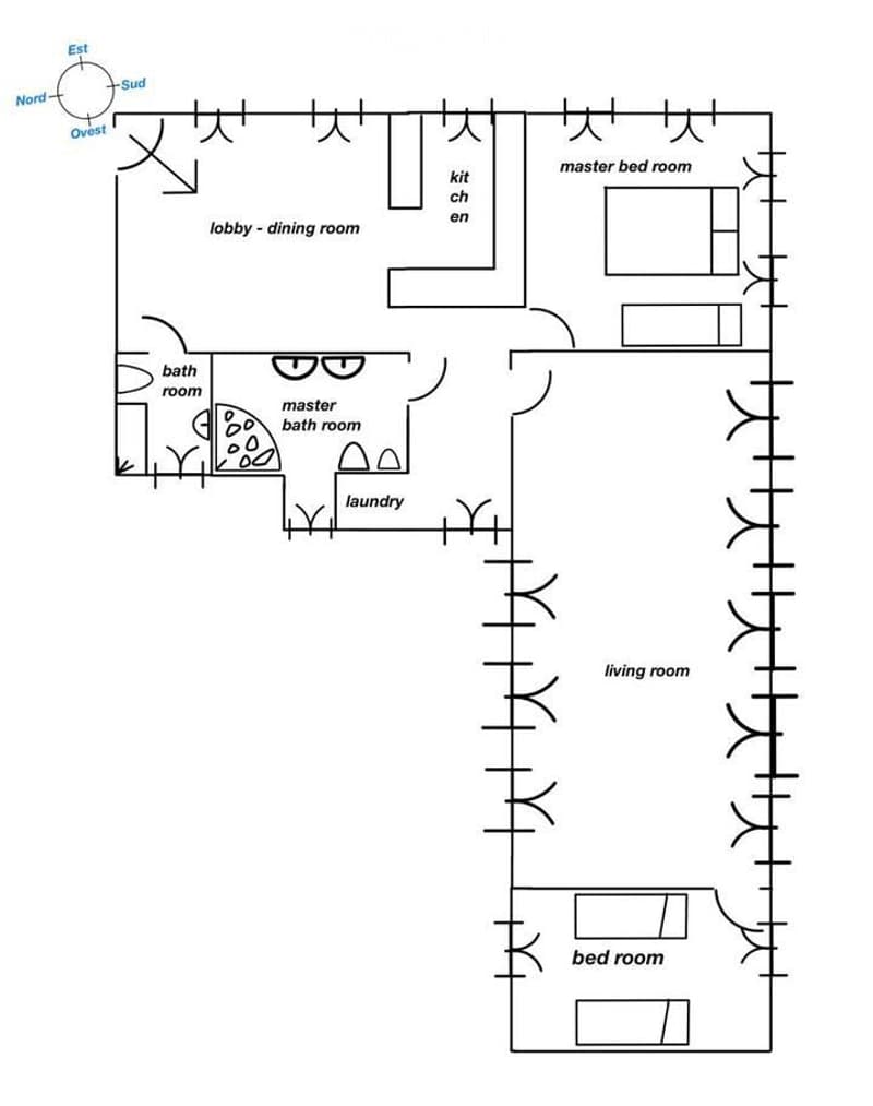 Floor plan of a house with a lobby-dining room, kitchen, master bedroom, master bathroom, living room, bedroom, bathroom, and laundry area.
