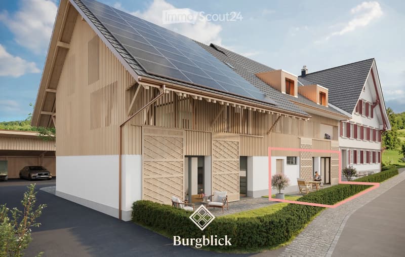 Modern two-story house with solar panels on the roof, a garage, and a well-maintained garden area with outdoor seating.
