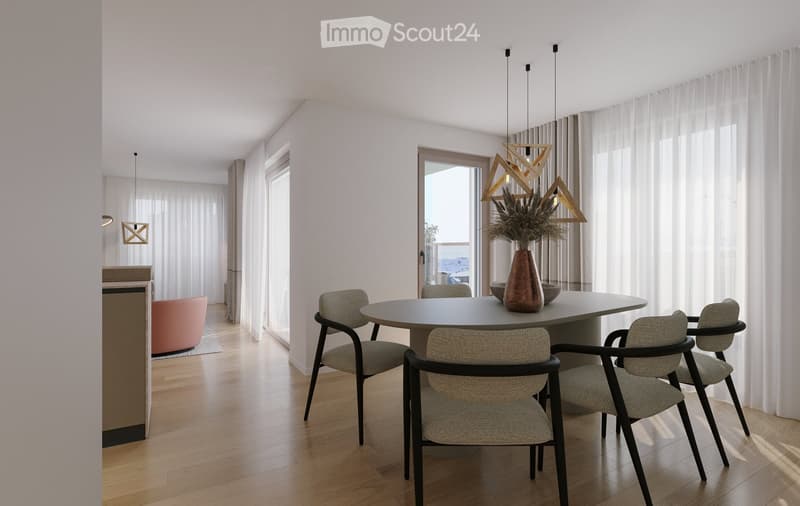 Modern dining area with a round table, four chairs, a vase with dried plants, and a small sofa in the background.