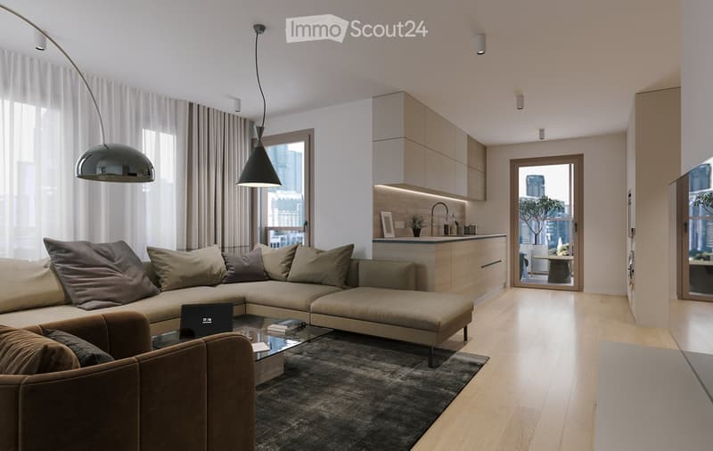 Modern living room with a sectional sofa, coffee table, laptop, books, armchair, and a small kitchen area with cabinets and a faucet. Large windows offer a city view.
