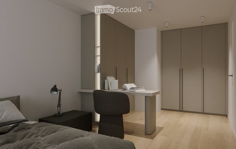 Modern bedroom with a bed, nightstand, desk, chair, and books. The room features sleek, grey-toned furniture and warm lighting.