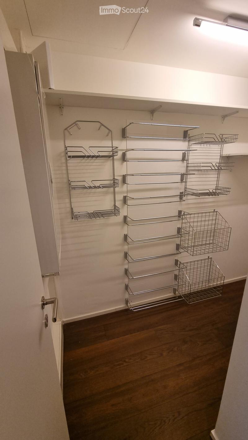 walk-in closet with metal shelves and baskets