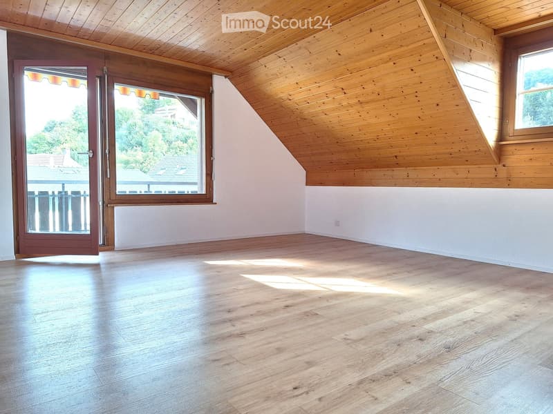 wooden ceiling, wooden floor, large windows, balcony with railings