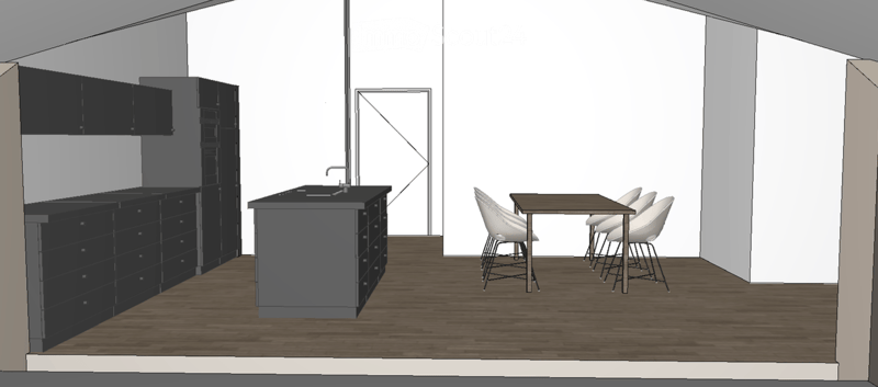 A modern kitchen with a central island, sink, and faucet, surrounded by black cabinets and a small dining area with a table and stools.