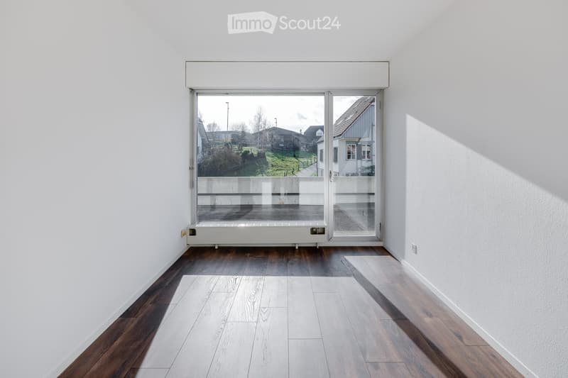 empty room, white walls, wooden floor, sliding glass door, balcony, natural light