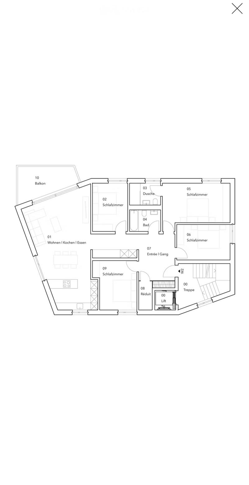 Floor plan showing a living/dining/kitchen area, four bedrooms, two bathrooms, a shower, a balcony, a hallway, a staircase, and an elevator.