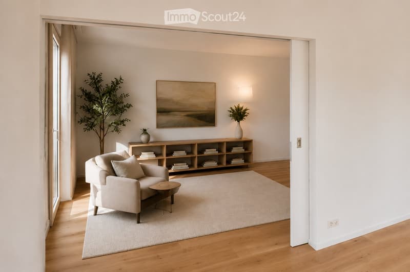 Modern living room with light-colored furniture, a sofa, coffee table, bookshelf, and decorative vases.