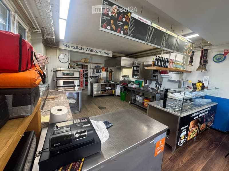{"type": "Kitchen", "objects": ["cash register", "oven", "microwave", "refrigerator", "counter", "shelves", "menu board", "clock", "toilet paper", "bottle", "oven", "fridge", "oven", "oven", "oven", "oven", "oven", "oven", "oven", "oven", "oven", "oven",