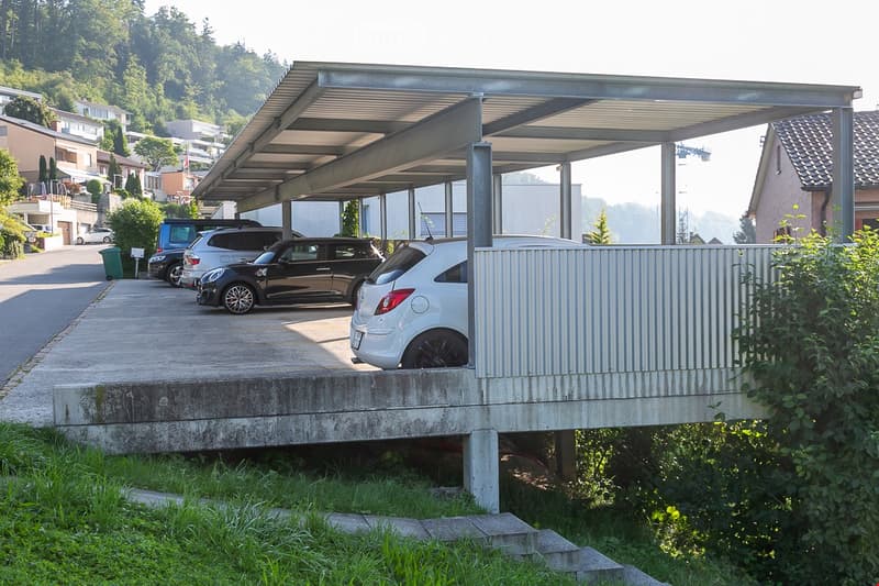 Car park with a canopy, 3 cars parked