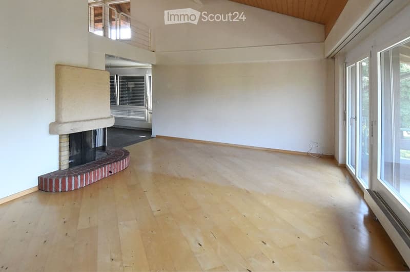 wooden floor, white walls, fireplace, glass doors, balcony