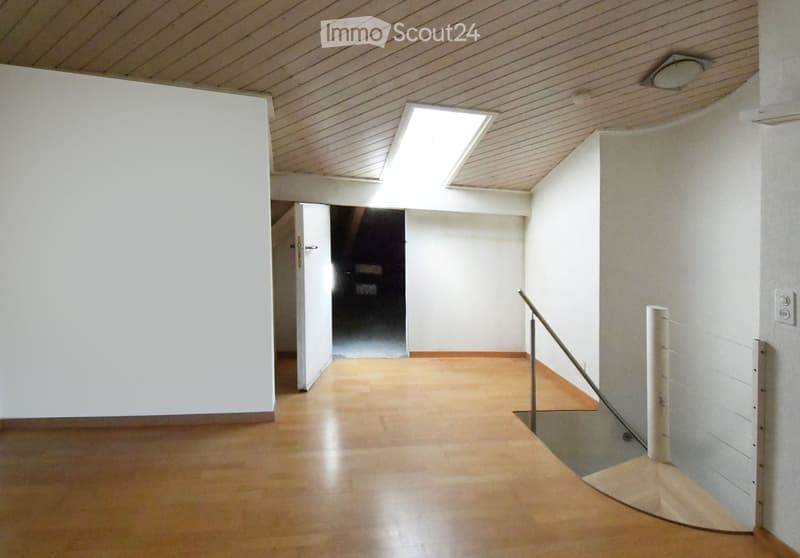 bright room with wooden floor and white walls, open door, window