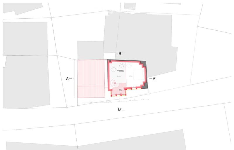 Floor plan showing a layout with a red-shaded area labeled 'MEZZANINE 11.7 m2' and a smaller section labeled 'FILET 3.4 m2'.