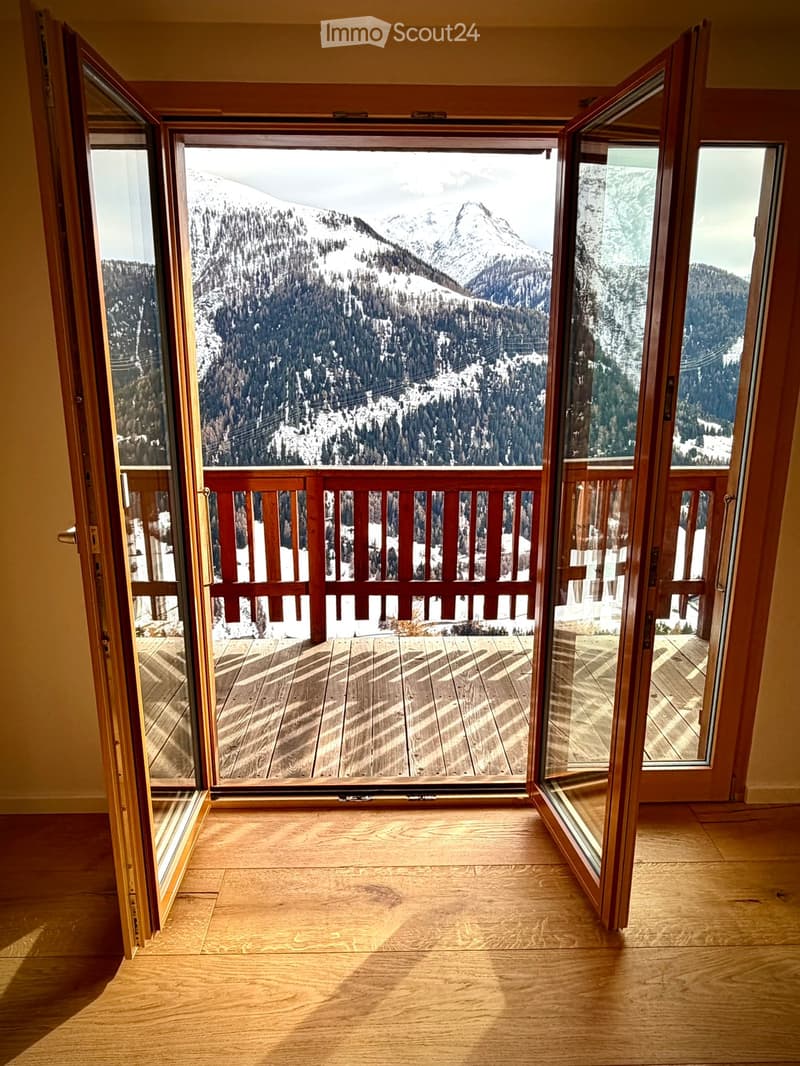 open double doors to balcony, wooden railing, wooden flooring, mountain view