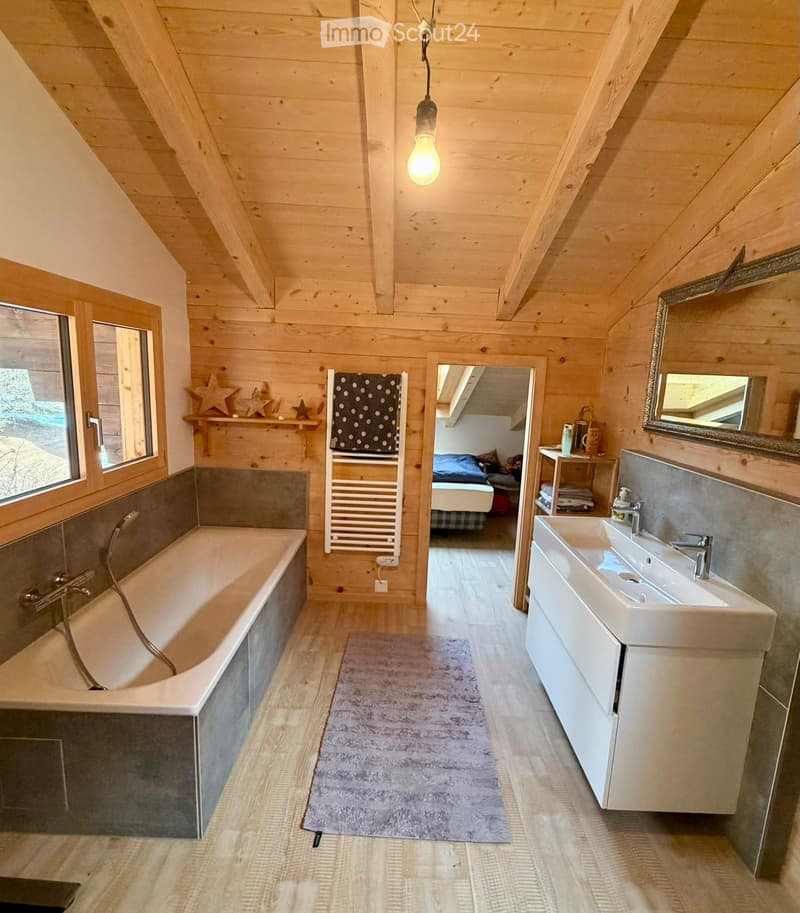 bathroom, wooden walls, bathtub, sink, mirror, toilet paper holder, towel rack