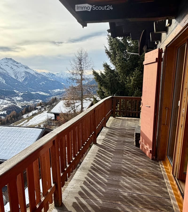 wooden railing, wooden floor, mountain view, shadow of railings