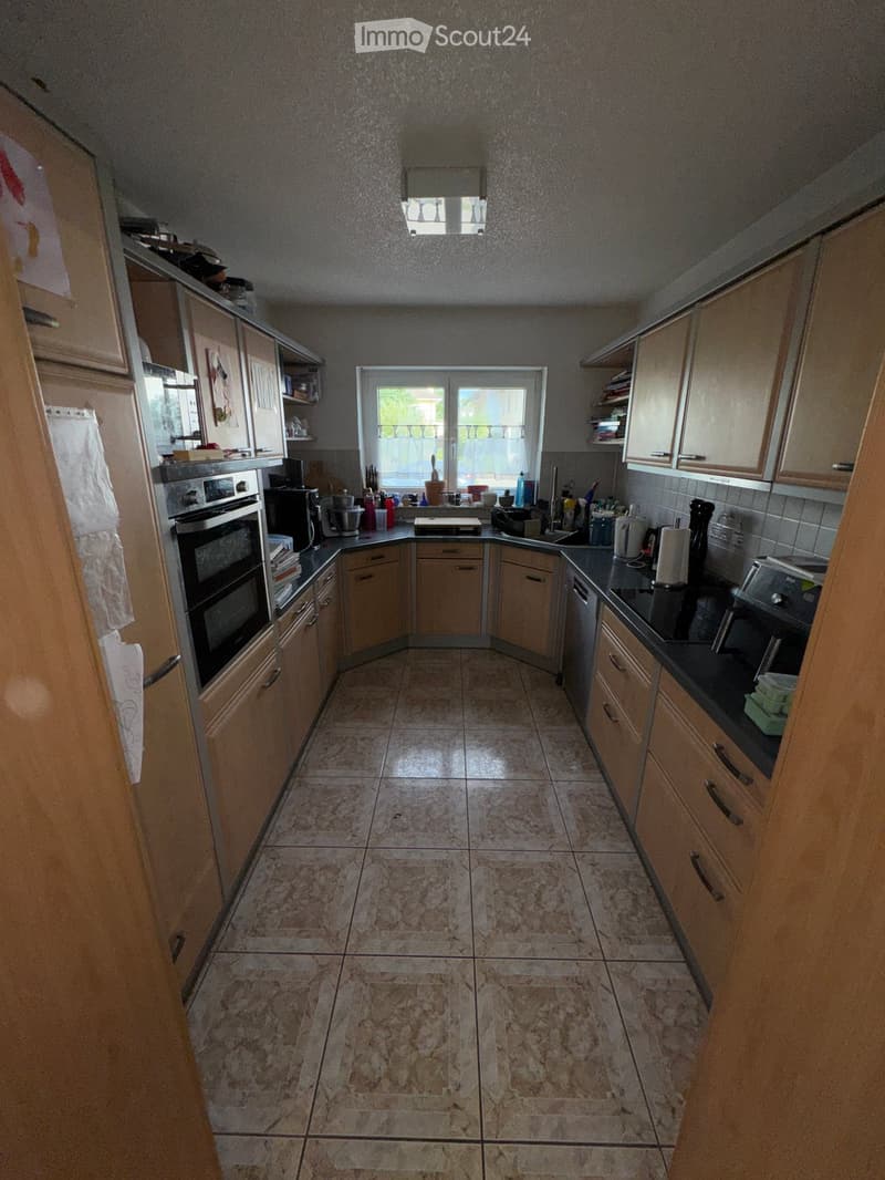 {"type": "Kitchen", "objects": ["oven", "dishwasher", "cabinets", "countertop", "sink", "faucet", "cutting board", "toaster", "refrigerator", "oven mitt", "oven gloves", "oven cleaner", "oven cleaner", "oven cleaner", "oven cleaner", "oven cleaner", "oven