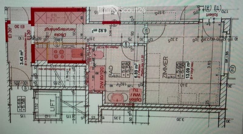 Floor plan of a residential building showing multiple rooms including a kitchen, living room, bedrooms, bathrooms, and a staircase. Dimensions and room labels are indicated.