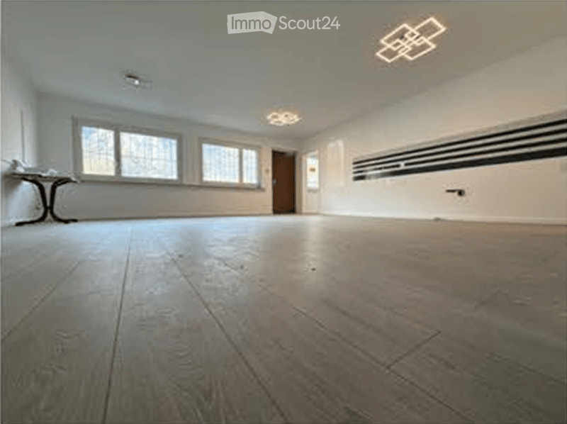 Completely empty room with bare walls and wooden floor. No furniture or equipment.