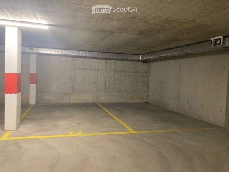 {"visible_features": ["Garage"], "type": "Garage", "objects": [], "description": "Empty underground parking garage with concrete pillars, marked parking spaces, and a single emergency exit sign.", "localized_descriptions": {"EN": "Empty underground parkin