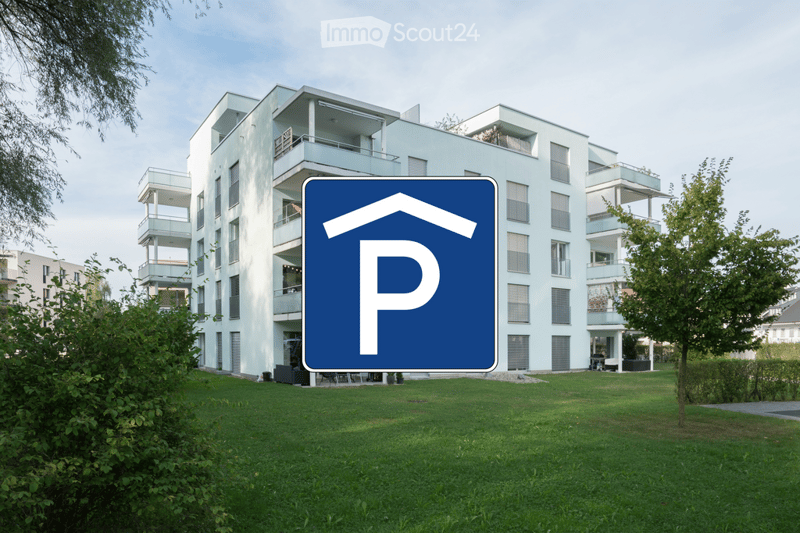 Modern multi-story residential building with balconies and a parking sign in the foreground.