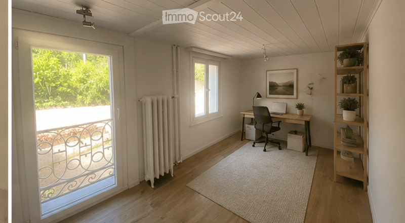 Bright, modern room with wooden flooring, large window, and balcony access. Features a desk with a chair, laptop, and potted plants, along with a shelf and radiator.