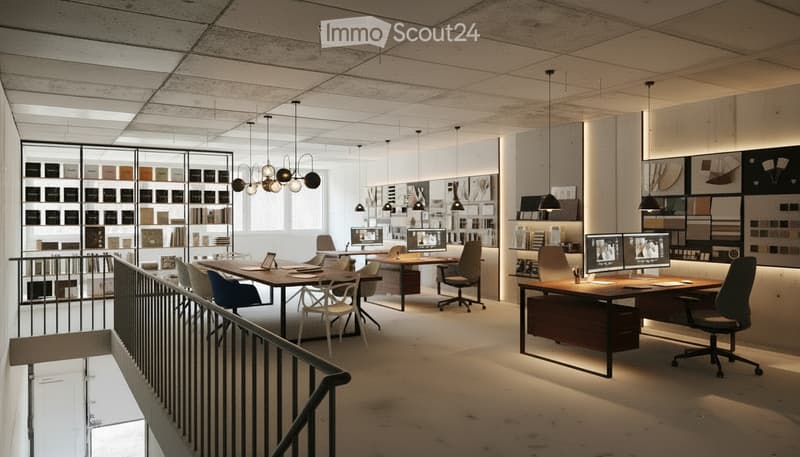 Modern office space with desks, chairs, multiple screens, and shelves displaying various materials.