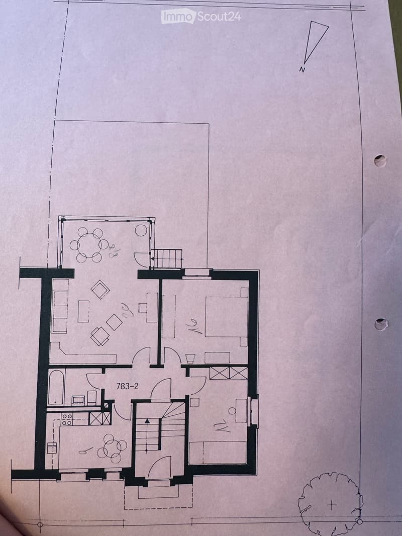 Floor plan of a residential space featuring a living area, dining area, kitchen, bedrooms, bathrooms, and a balcony.