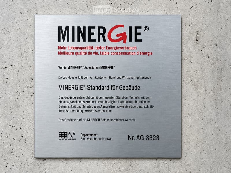 Certificate for a MINERGIE-standard building, featuring text in German and French, with logos and a reference number.