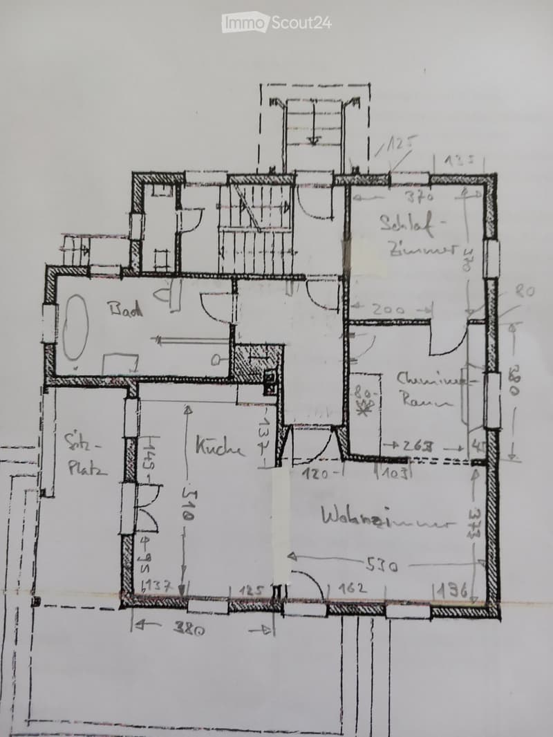 Floor plan showing a layout with labeled rooms including a kitchen, living room, bedroom, bathroom, and hallway. Dimensions are marked in centimeters.