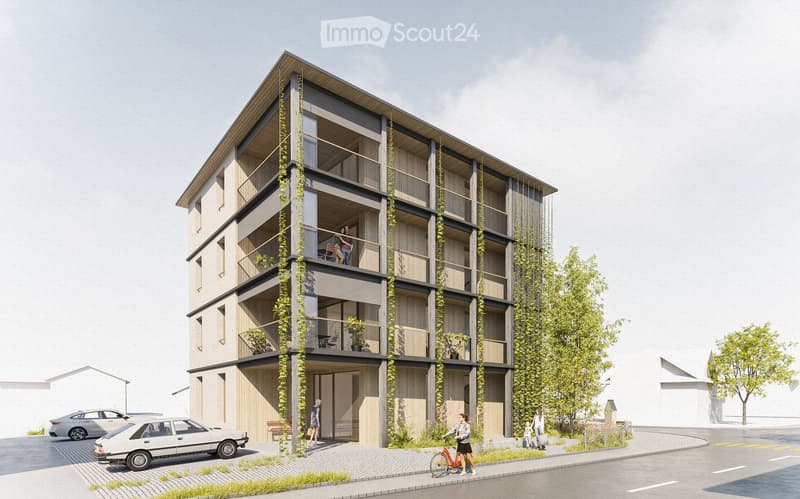 Modern multi-story building with balconies, greenery, and a contemporary design. The structure features a combination of wood and concrete, with large windows and a sloped roof. There are several balconies adorned with plants and furniture, and a few peop